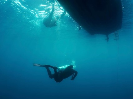An underwater diver on his way back to the boat. Giuseppe Dezza wreck dive site, Pula, Croatia,