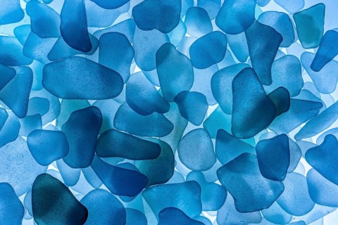 Blue broken glass cut by the sea, sea glass, sea glass, beach glass from the North Sea