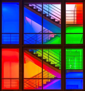 View through the windows of a brightly lit staircase. Frankfurter Mainova AG building, city center,