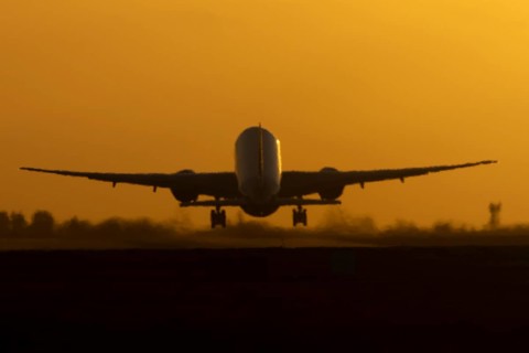 Boeing 777 A7-BFL commercial jet aircraft of Qatar cargo taking off in flight silhouette at sunset