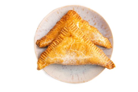 Triangles Pie, Puff Pastry, Samsa with cherry jam isolated on white background, top view, flat lay,