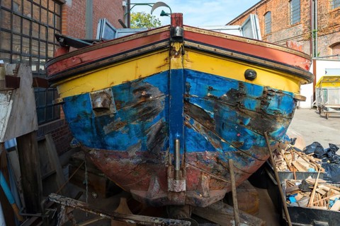 Old barge at a shipyard, Italy