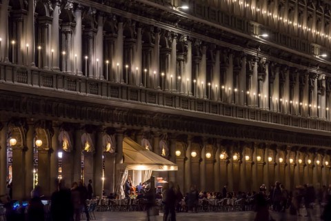 Authorized parties in a nocturnal atmosphere with music band on St. Mark's Square, Venice, Veneto,