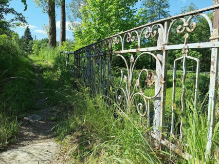 An old, rusty iron fence along a grassy path, Upper Franconia