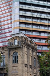 Batumi, Georgia. July 21st 2025. Old traditional style Georgian architecture and modern skyscraper