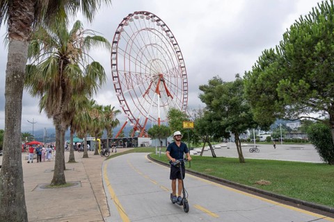 Batumi, Georgia. July 21st 2025. Visitors and tourists ride electric scooters along a dedicated