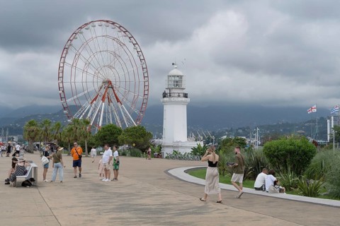 Batumi, Georgia. July 21st 2025. A light house and Ferris wheel near Batumi Port, a popular