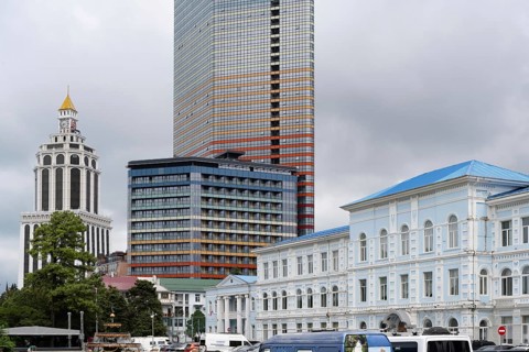 Batumi, Georgia. July 21st 2025. Old traditional style Georgian architecture and modern skyscraper