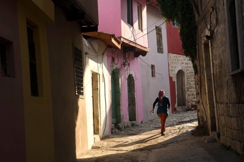 Antakya, Turkey. December 22rd 2013 Young local girl runs through the narrow alleyways of the old