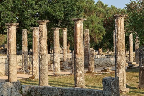 Palestra, collection of ancient columns surrounded by trees, archaeological site, Ancient Olympia,
