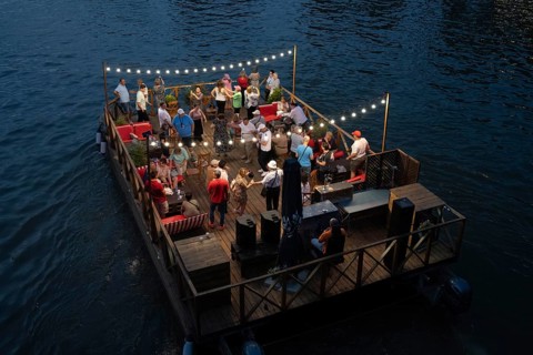Tbilisi, Georgia. September 5th 2025. Tourists enjoy dancing and drinking on a floating raft type