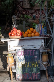 A local street stall selling fresh pomegranate and orange juice in the Old Town district of