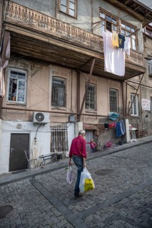 Tbilisi, Georgia. September 12th 2025 An old man walks through the cobbled narrow streets past