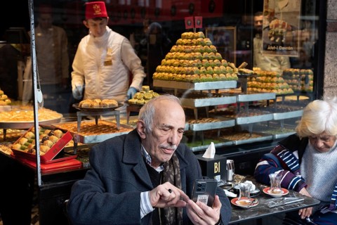 Istanbul, Turkey. January 3rd 2025. An elderly gentleman using his mobile phone outside a Turkish