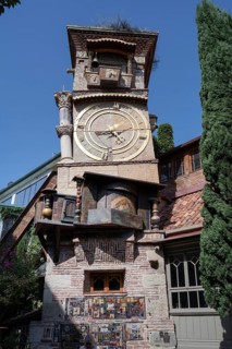 Tbilisi, Georgia. August 5th 2025. The ornate clock tower of the Gabriadze Marionette Theater,