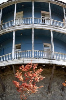 Tbilisi, Georgia. August 5th 2025. An old traditional blue painted Georgian building with a typical