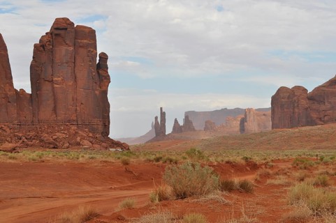 Wide, dry landscape with distinctive rocks and red sand, Monument Valley, Navajo Tribal Park,