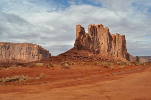 Impressive rock formations stand in a vast red desert landscape, Monument Valley, Navajo Tribal