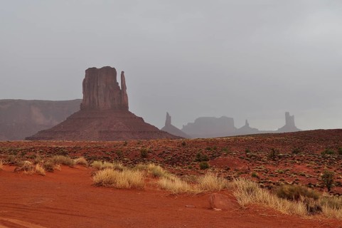 View of Monument Valley's distinctive rock formations after a heavy thunderstorm. Monument Valley,