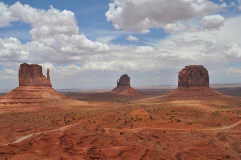 Dramatic rock formations against a cloudy sky in Monument Valley, Navajo Tribal Park, Navajo Nation