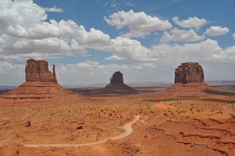 Three distinctive rocks in Monument Valley against a dramatic cloudy sky, Monument Valley, Navajo