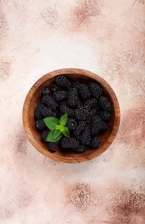 Blackberries, in a wooden bowl, top view, no people