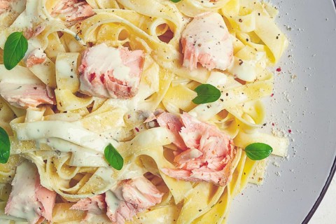 Tagliatelle pasta, in cream sauce with salmon, homemade, no people
