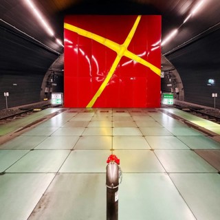 Lohring subway station with red enamelled wall with a painted light cross by Eva-Maria Jöressen,