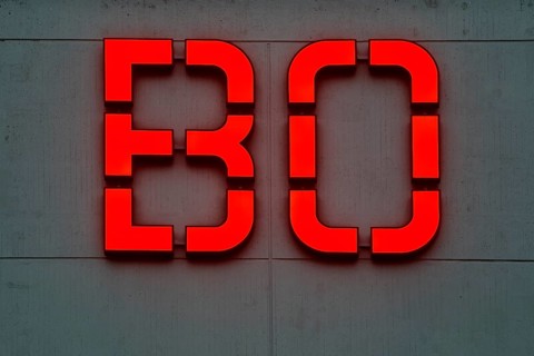 Detailed view of the red BO logo in the evening at the main building of Bochum University, Ruhr