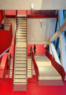 Staircase with signal red color scheme in seminar building H of Bochum University, Ruhr area, North