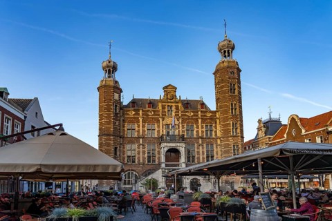 Restaurant and the historic town hall on the market in Venlo, the Netherlands