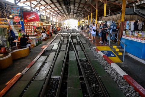 Mae Klong, Thailand. March 15th 2025. Rail lines at the Maeklong Railway station with cafes and