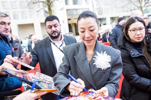 Michelle Yeoh signs autographs ahead of the premiere of the film Everything Everywhere All At Once