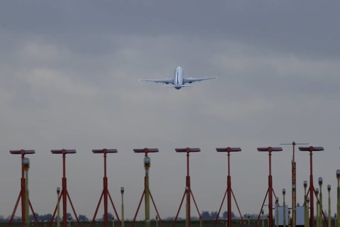 Boeing 737 commercial passenger airliner jet aircraft taking off in flight at London Stansted