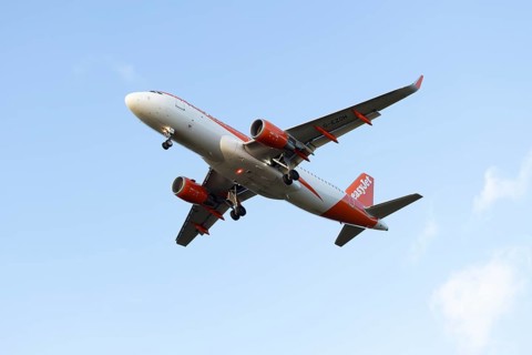 Airbus A320 commercial passenger airliner jet aircraft of Easyjet airlines flying on approach to