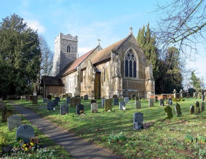 Village parish church of Saint Mary, Martlesham, Suffolk, England, UK and its rural churchyard with