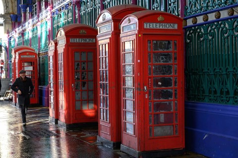 London, UK. January 30th 2025. A man walks past a row of old fashioned telephone boxes in