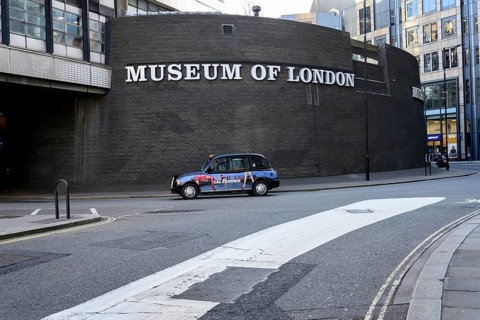London, UK. January 31st 2025. A classic London black cab passing the Museum of London, covering