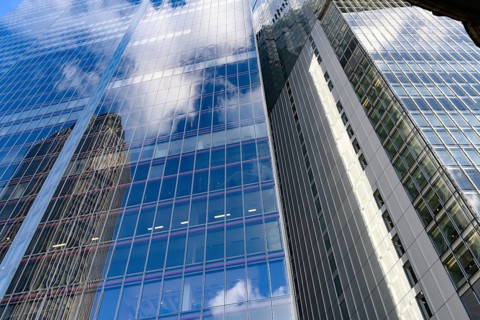 Modern abstract reflections in glass fronted commercial office buildings in the financial district