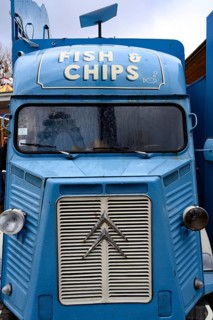 A blue retro Citroen food truck selling traditional British fish and chips on the south bank of the