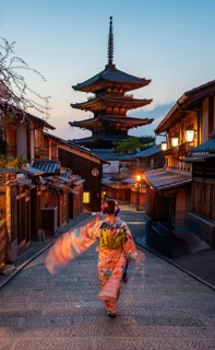 Japanese woman wearing kimono in an alley, Yasaka dori historic alleyway in the old town with