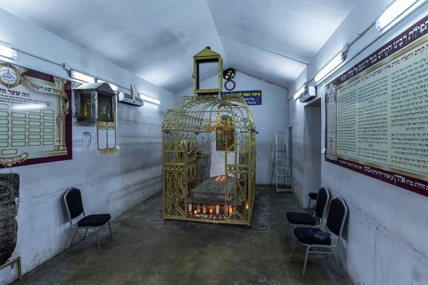 Tomb of Hasidic Rabbi Elimelech in a gilded grid at the Lezajsk Jewish Cemetery, Poland