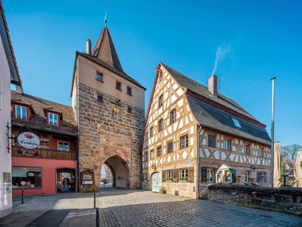 The Hersbrucker Tor and a half-timbered house in Lauf an der Pegnitz, Middle Franconia, Bavaria,