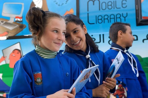 Latakia Countryside, Syria. October 18th 2010 Syrian schoolchildren collecting books from a mobile