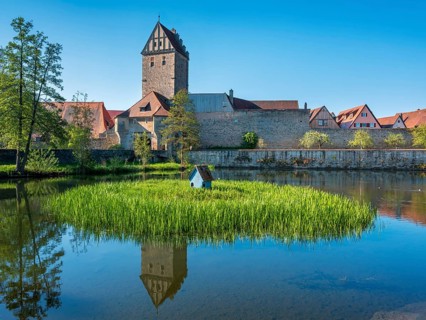 View across the Rothenburg pond to the historic old town with city wall and Rothenburg Gate,