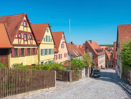 Street with typical town houses, wooden fences and cobblestones, Dinkelsbühl, Ansbach district,