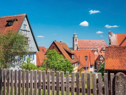 View over wooden fence to the houses in the historic old town and St. Georg Cathedral, on the right