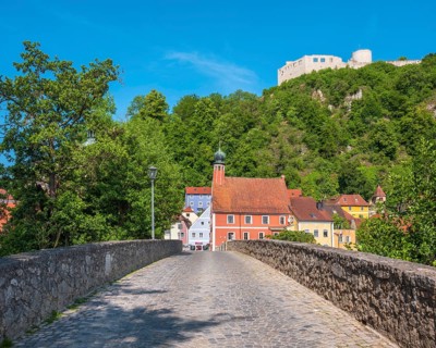 The historic old town with castle ruins, parish church of St. Michael and Steinerner Brücke,