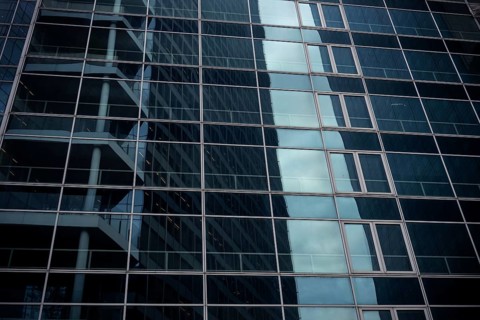 Abstract architecture of a glass fronted office building in a Paris commercial and financial