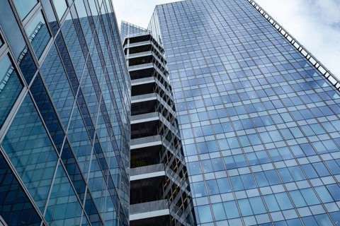 Abstract business architecture of a glass fronted office building in a Paris commercial and